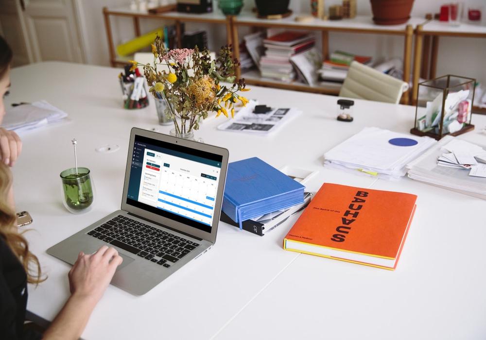 Professional working on a laptop in a modern office